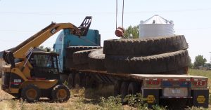 Using Skid Steer to help load tire tanks